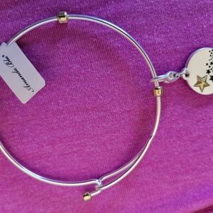 Costume silver bangle bracelet with stars on the hanging charm